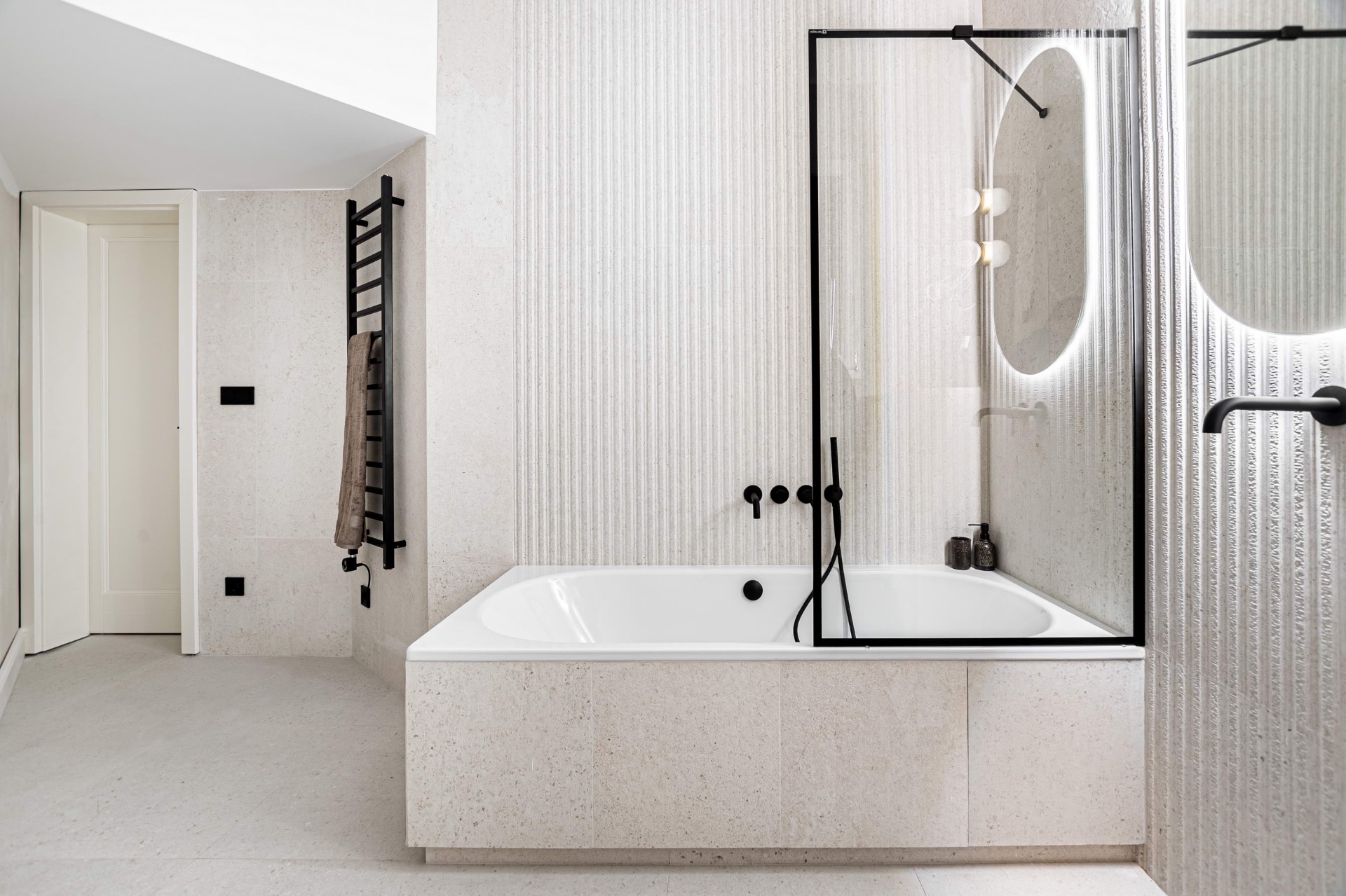 Stone-clad bath with premium fittings