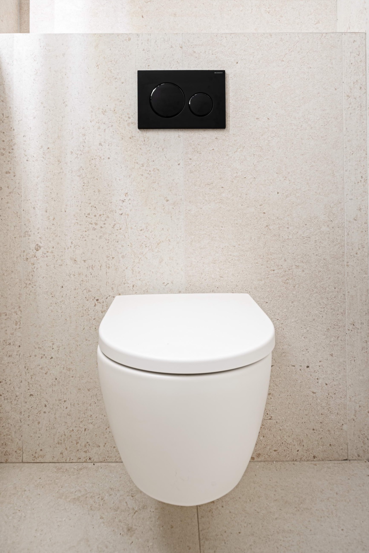 Geberit wall-hung WC on limestone