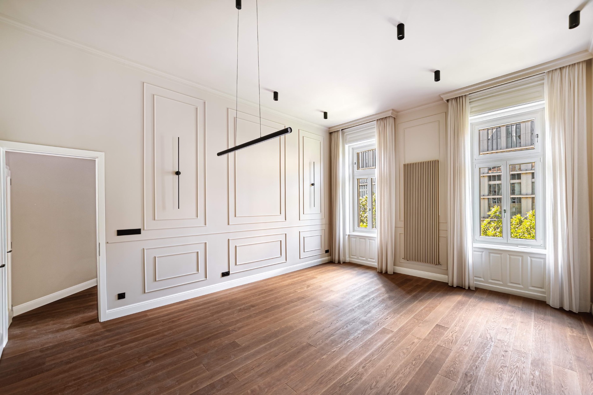 Panelled salon with designer lighting